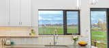 Kitchen view of Blue Mountains, locally sourced, integrated floating wood shelf designed and crafted by client