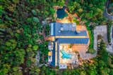 The 11,438 square foot residence sits on 3.66 wooded acres directly below the imposing peaks of Mount Olympus.
