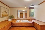A Luxurious Soaking Tub In The En Suite Primary Bathroom