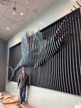 Nick Stoppello stands infront of the final sailfish installation prior to the grand opening of Coa Del Mar in Eagle, Idaho 
