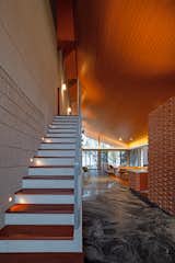The open stairs lead to the upper bedrooms.