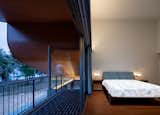 The master bedroom faces east, opening up to the vast expanse of the Thapsakae Beach.
