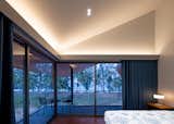The master bedroom faces east, opening up to the vast expanse of the Thapsakae Beach.