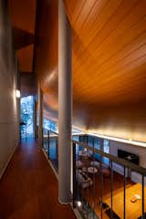 The upper walkway overlooking the open living + dining area