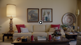 original paintings, custom lamp made from a post from a New Orleans stairwell, and a 75 year old couch back in vogue
