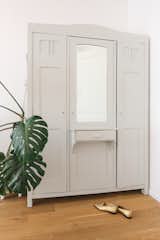 A renovated vintage wardrobe, refreshed in a soft pastel turquoise-grey hue.