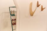 Personal objects are displayed as sculptural compositions throughout the space.
