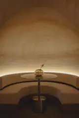 Each grotto features custom-fitted furniture with wall-mounted benches and integrated lighting.