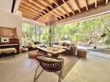 Living room opens up to yard and outdoor dining area. Sofa by Restoration Hardware. Coffee table by Malibu Design. Lamp by Audra. Rug by The Rug Collective.