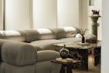 Double height Living Room -soft, sculptural seating invites relaxation while a richly veined marble coffee table anchors the space in timeless elegance, complemented by curated decor and warm natural light