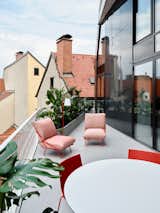 Seamless light microcement floor that extends across all indoor and outdoor surfaces