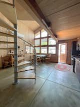 This is a view from the  first floor. The spiral staircase fits this space perfectly and helps conserve space.