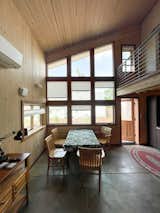 The downstairs includes a master bedroom, full bathroom, kitchen, and dining space.
