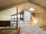 Floor-to-ceiling windows in addition to skylights help illuminate the both levels of the home naturally. A design that harnesses natural light, ventilation, and a layout to support healthy family life over many generations are some of what makes the home so beautiful. 