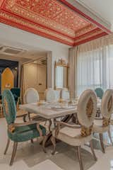 Dinning area with a beautiful celling element which is creating contrast at the same time enhancing the royalty