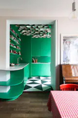  I chose deep green as the dominant colour to reflect and amplify the brightness of the space