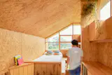 A hatch in the sleeping area leads down to a semi-subterranean level.