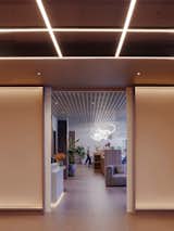 Ceiling grid in arrival space, with residents' lounge beyond