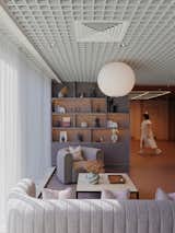 Sancal sofa and seat beneath feature grid ceiling